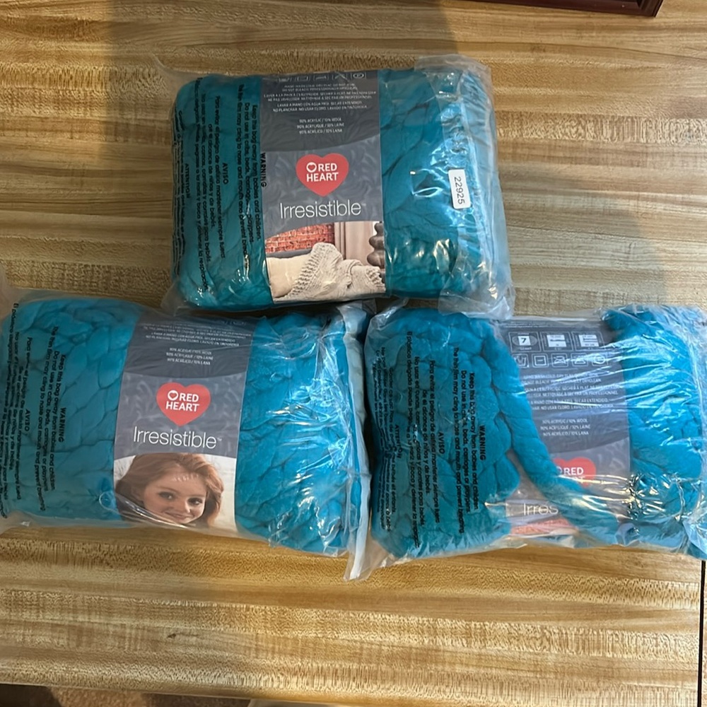 NWT. Red Heart Irresistible Yarn in Teal